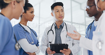 Buy stock photo Doctors, team and advice on tablet in hospital for healthcare review, telehealth analysis or online test results. Medical group, people or discussion on digital technology for planning information
