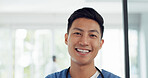 Asian man, face and doctor smile for healthcare, vision or career ambition and advice at the hospital. Portrait of happy and confident Japanese medical expert smiling, phd or medicare at the clinic