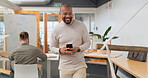 Businessman in office walking, typing on smartphone and greeting people at creative startup. Communication, technology and black man on walk at business checking phone for social media, email or text