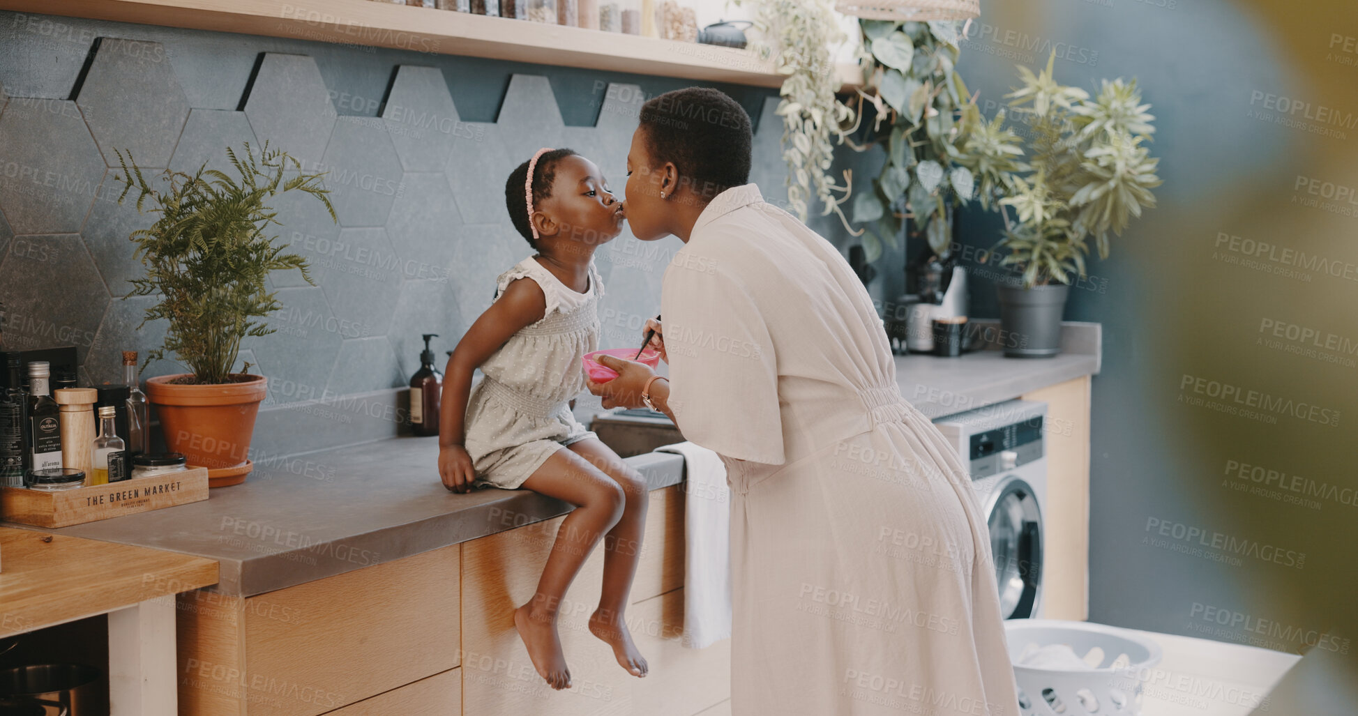 Buy stock photo Mother and child, kiss and table in kitchen, feeding and food for lunch, love and help for bonding. Black woman and girl, care and nutrition for diet, health and growth or development, home and happy