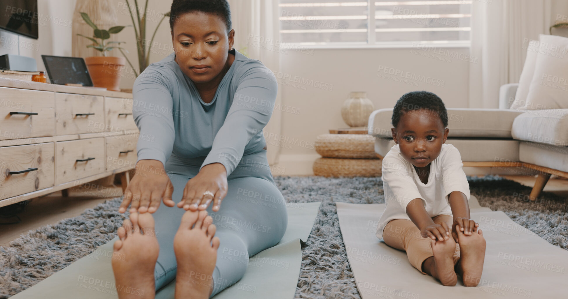 Buy stock photo Black family, yoga and a mother with her daughter in the home together for fitness, wellness or balance. Kids, exercise or stretching with a woman parent and girl child in the living room for health
