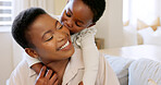 Love, mother and excited child hug playing together bonding in bedroom at house. Happy black woman and baby affection smile, trust and support care or enjoy spending quality time at family home