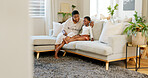 Relax, child and mother watching tv on the sofa in the living room of their house together. Excited, African and young kid with a cartoon, film or movie with their mom on the couch of their house