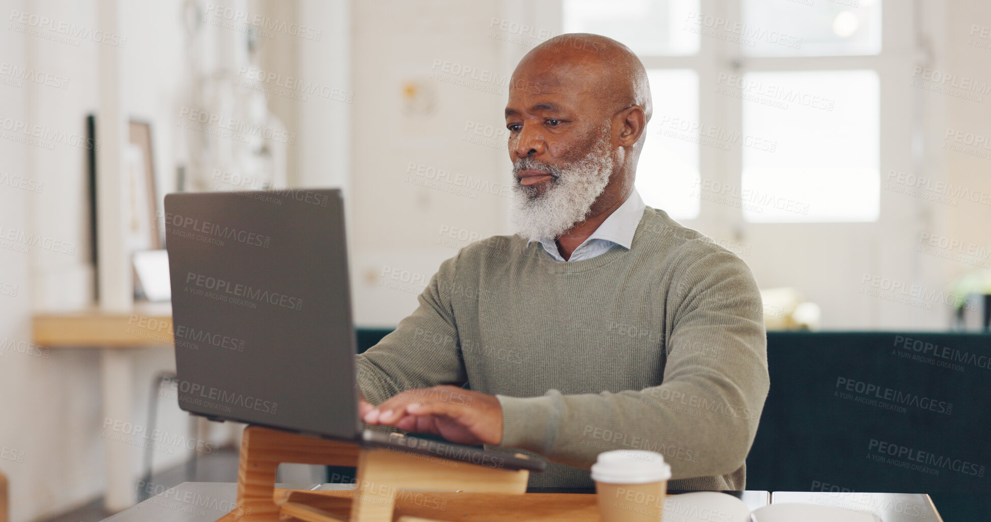 Buy stock photo Laptop, typing and senior businessman working at home office for corporate research in HR. Technology, reading and professional elderly African male ceo planning company strategy on computer in house