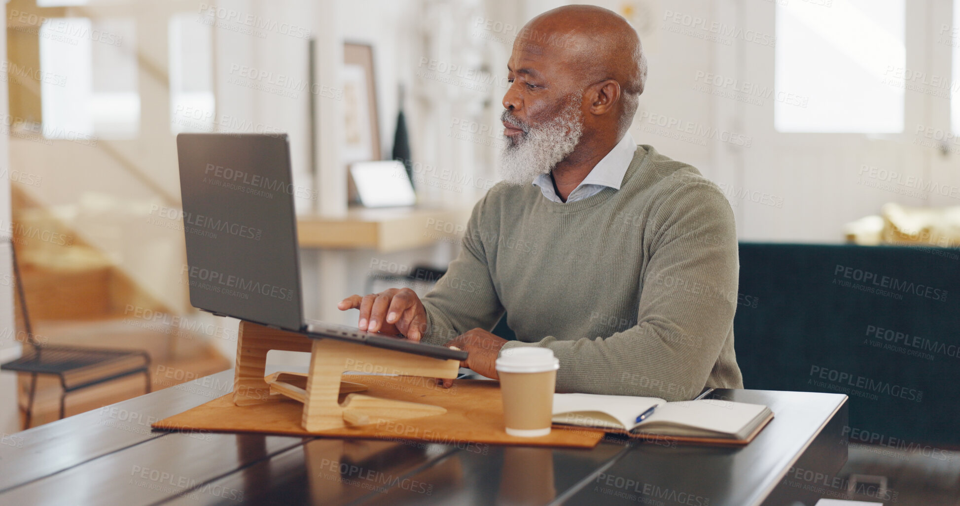 Buy stock photo Laptop, focus and senior businessman working at home office for corporate research in HR. Technology, reading and professional African elderly male ceo planning company strategy on computer in house.