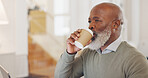 Black man, laptop and coffee for remote work as freelancer while thinking, planning and working on strategy for small business vision and future. African entrepreneur with motivation in home office