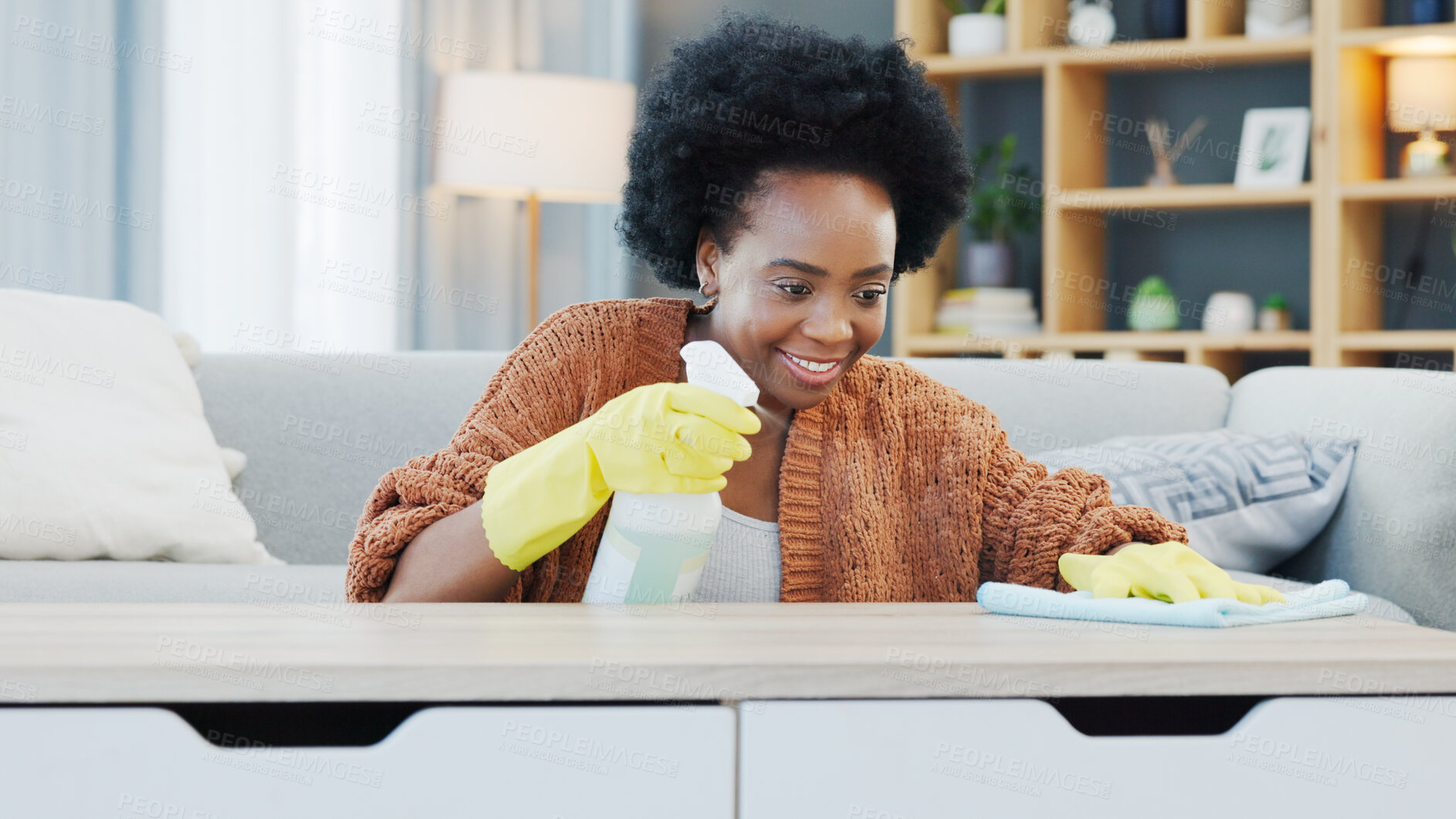 Buy stock photo Happy black woman, spray bottle and housekeeping or cleaning table for disinfection or hygiene at home. African female person, maid or cleaner smile and wiping furniture for bacteria or germ removal