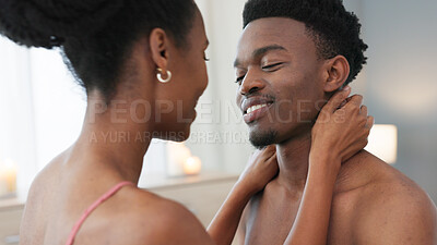 Black couple kiss on bed in bedroom in home, a man and woman together in relationship. African American girl and guy kissing, sensual and romantic moment in the morning. Love, passion and intimate