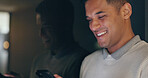 Face, phone and dark with a business man laughing in an office, working late at night on a deadline. Mockup, contact and good news with a male employee typing a text message at work during overtime
