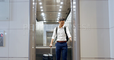 Elevator, travel and watch with a business asian man in an airport, checking the time of his flight for departure. Door, floor and late with a male employee holding suitcase luggage while traveling
