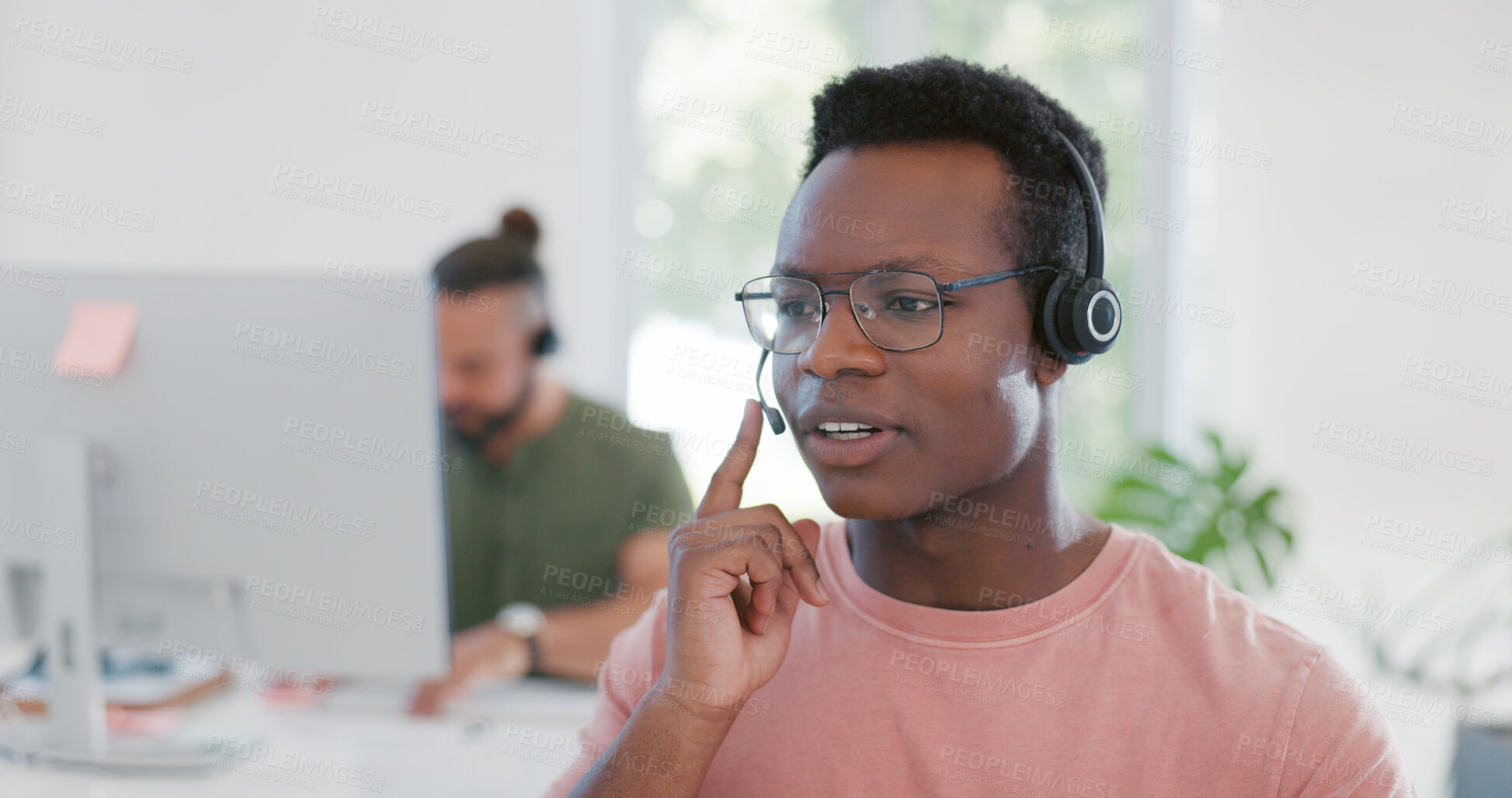 Buy stock photo Call center, customer service and man consultant in the office with an online consultation. Technology, contact us and African male telemarketing agent working on crm with headset in modern workplace