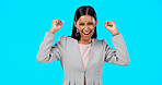 Yes, winning and woman cheers isolated on blue background celebration, excited and fist pump for lotto. Wow, happy winner or indian person face to celebrate prize, competition or bonus news in studio