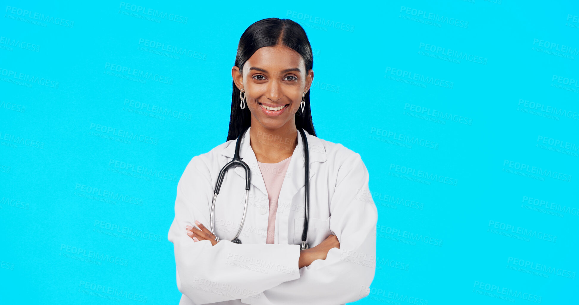 Buy stock photo Happy woman, portrait and professional doctor with arms crossed in healthcare against a blue studio background. Female person, nurse or medical surgeon smile in confidence for health advice on mockup