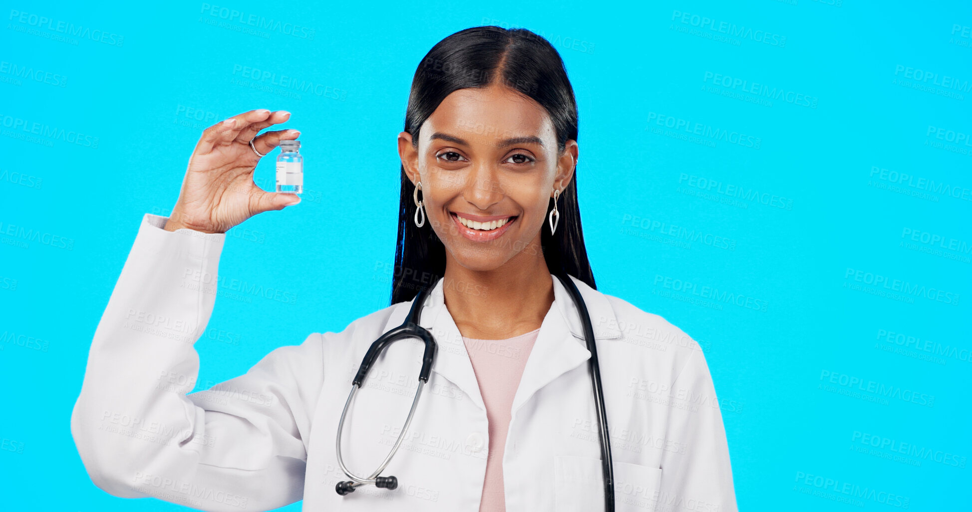 Buy stock photo Woman, doctor and bottle with vaccine, healthcare and injection with medicine in portrait on blue background. Health, medical professional with drugs, immunity or safety from virus in a studio