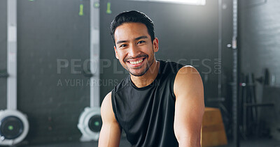 Fitness, exercise and laughing with a man in a gym for a workout or training to get strong or healthy. Wellness, smile and portrait with a happy young male athlete in a health club for exercising