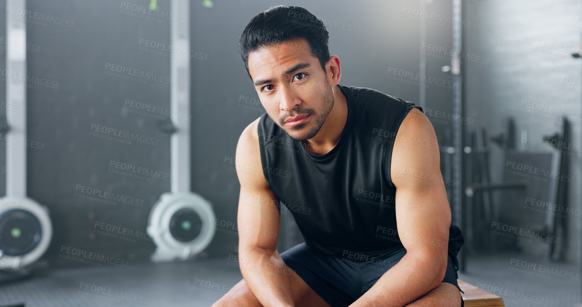 Buy stock photo Bodybuilder, portrait and man in gym for fitness, training or healthy stress management exercise and sport. Asian, athlete and serious motivation for wellness or goal in club for mental health