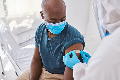 Buy stock photo Man getting covid vaccine, plaster for protection and control of virus with a medical doctor at hospital. Expert, professional or healthcare worker helping patient, doing checkup and giving injection