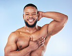 Body wash, cleaning and man portrait in a studio with happiness from wellness and hygiene. Armpit, shower and clean skincare of a happy male model with a smile from washing, muscle and self care