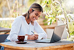 Woman with smile, writing notes and student, education with study and academic course, learn and university. Female at outdoor cafe, notebook and pen with scholarship and research for school project 