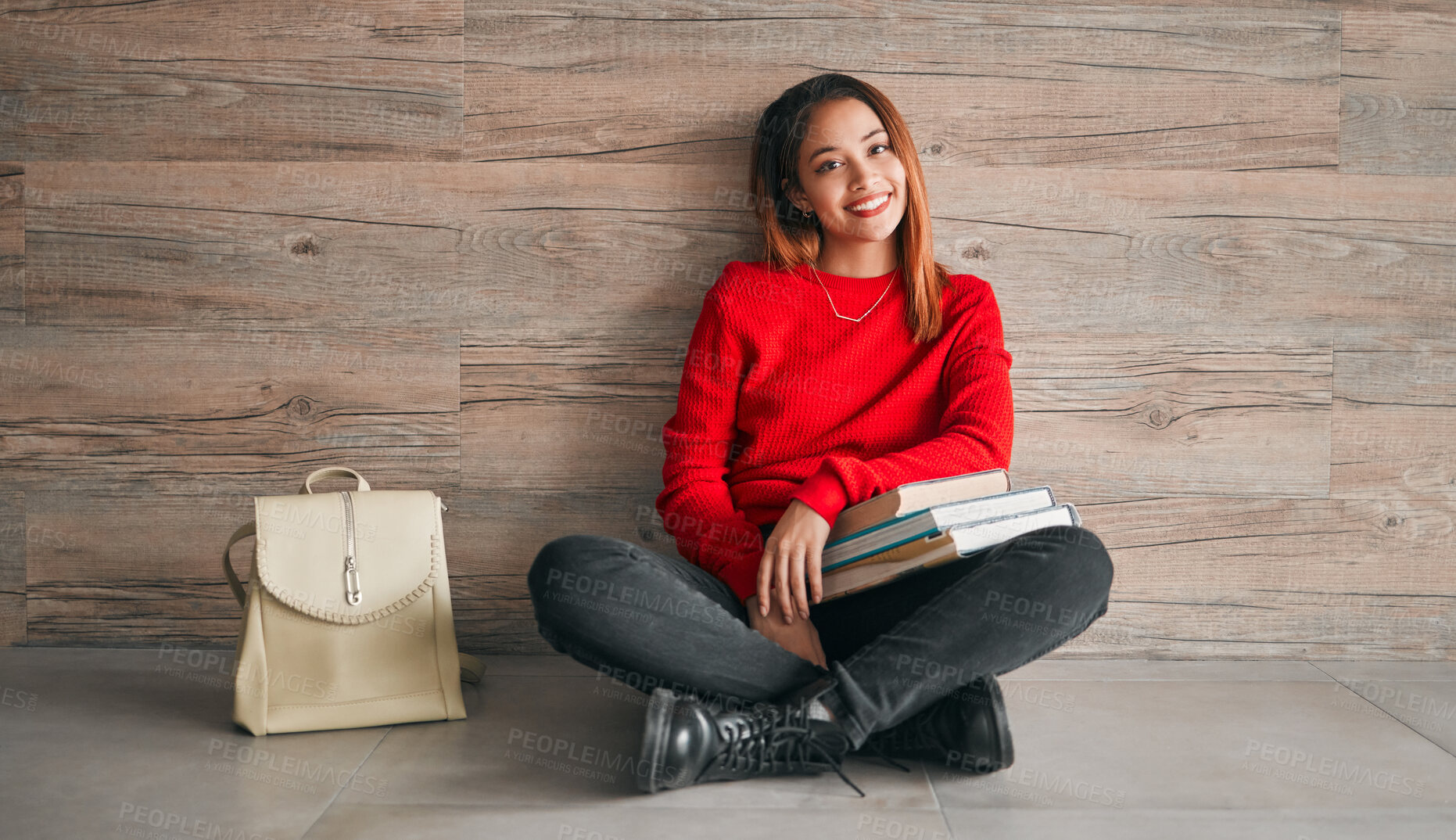 Buy stock photo University, portrait of woman with books and smile on floor, education at college on wall background mockup. Information, knowledge and space, student with backpack and happiness with book to study.