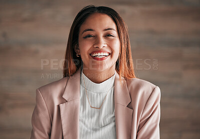 Buy stock photo Portrait, happy and a business woman on a wooden background in studio with a positive mindset. Face, smile and motivation with a carefree young female employee feeling cheerful for a corporate career