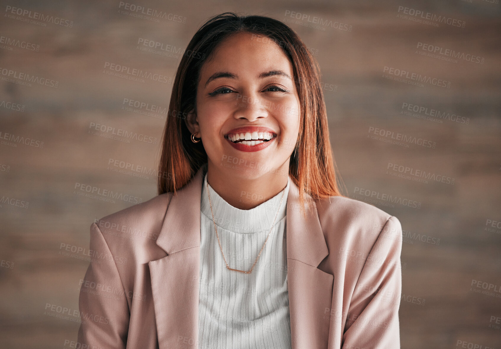 Buy stock photo Portrait, happy and a business woman on a wooden background in studio with a positive mindset. Face, smile and motivation with a carefree young female employee feeling cheerful for a corporate career