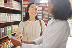 Dispensary, health or prescription with a pharmacist and asian woman customer talking about a product. Healthcare, consultant and a medicine professional talking to a happy female in a pharmacy