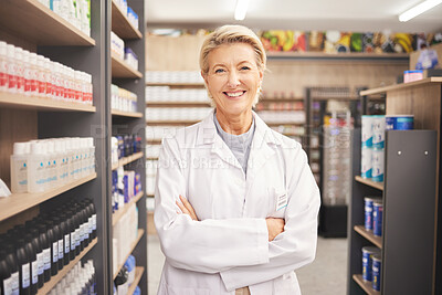 Pharmacy, senior woman pharmacist in portrait at drug store and pills with medicine for healthcare. Drugs, health and arms crossed, pharmaceutical and happy with confident female medical professional