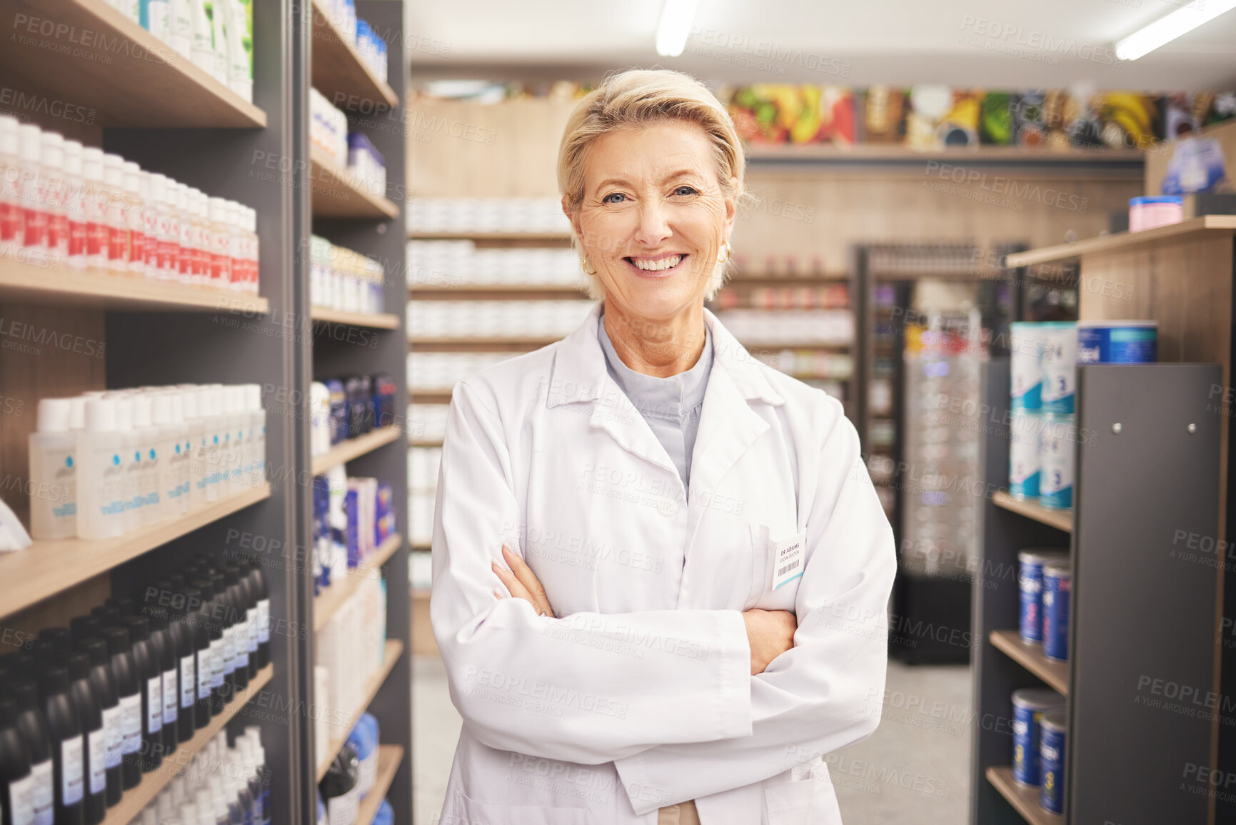 Buy stock photo Pharmacy, senior woman pharmacist in portrait at drug store and pills with medicine for healthcare. Drugs, health and arms crossed, pharmaceutical and happy with confident female medical professional