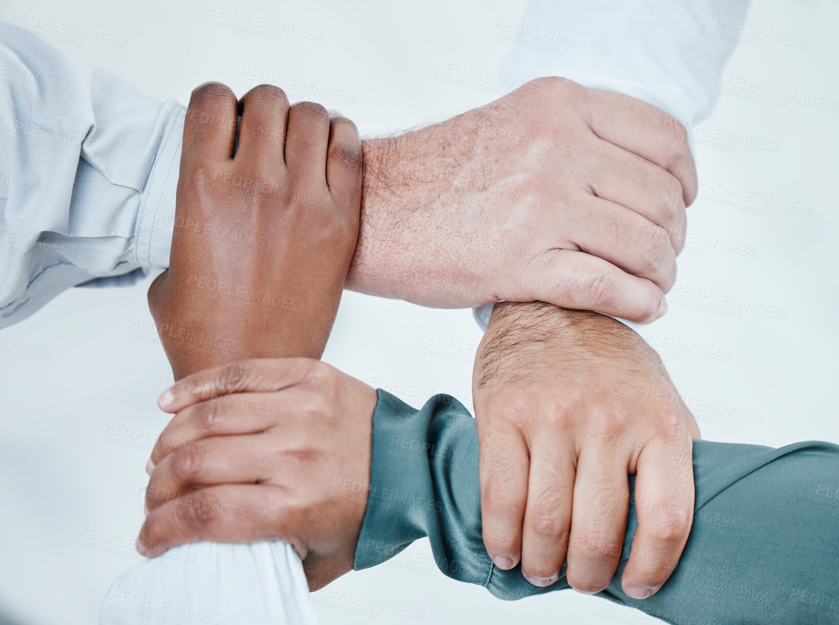 Buy stock photo Teamwork, hands connect and business people for collaboration, support and community in office. Solidarity, diversity and top view of employees holding arms for team building, mission and goals