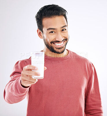 Buy stock photo Milk, man and portrait with happiness in a studio with calcium, healthy and nutrition drink. Isolated, white background and male model with a smile feeling happy from weight loss and detox smoothie