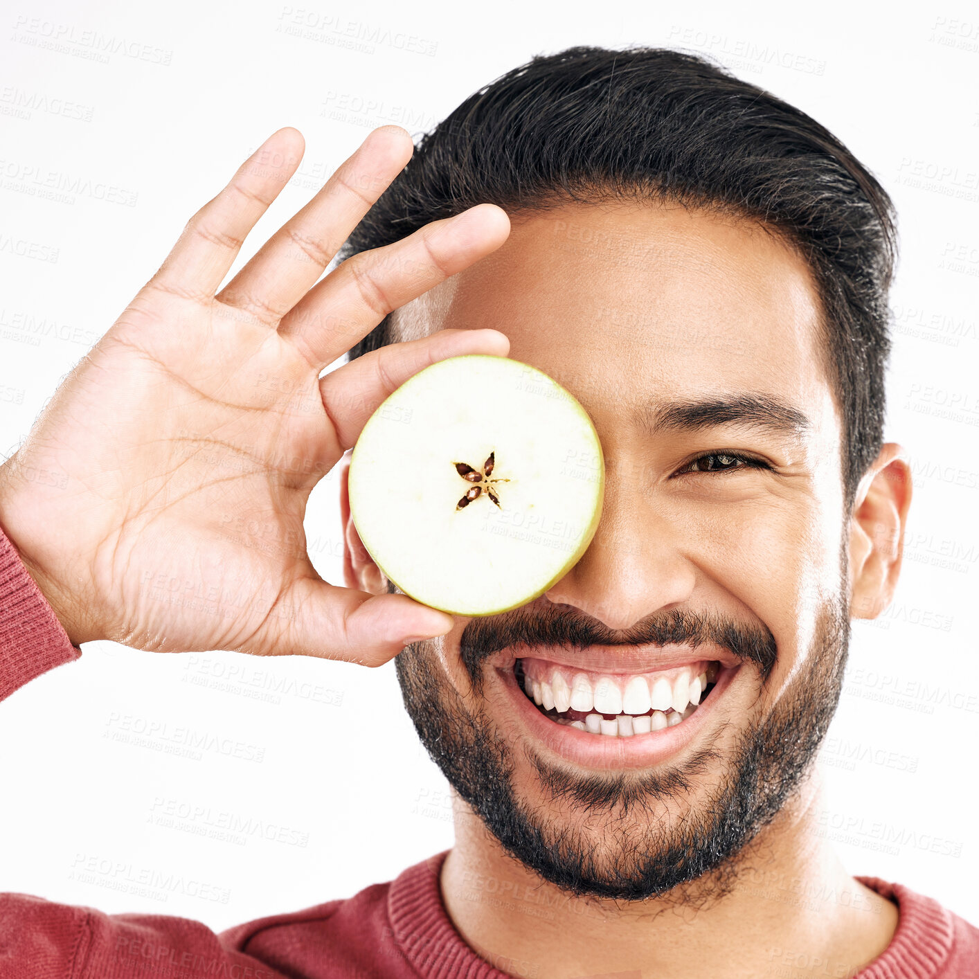 Buy stock photo Apple, fruit and portrait of man with smile on white background for diet, nutrition and detox. Healthy body, food and isolated face of happy male with slice for breakfast, snack and lunch in studio