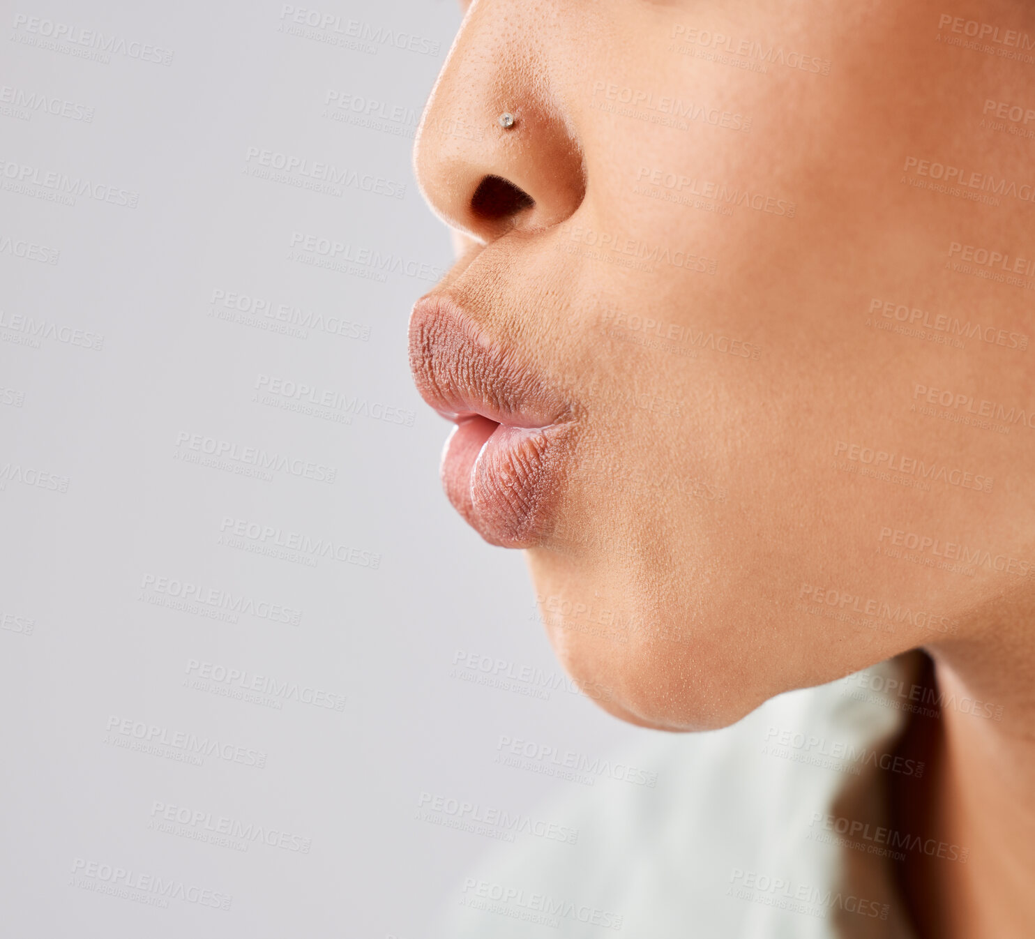 Buy stock photo Pout, lips and woman face whistle with her mouth or kiss with lipstick or gloss isolated in a white studio background. Flirting, care and natural lip of a female person showing love, care and romance