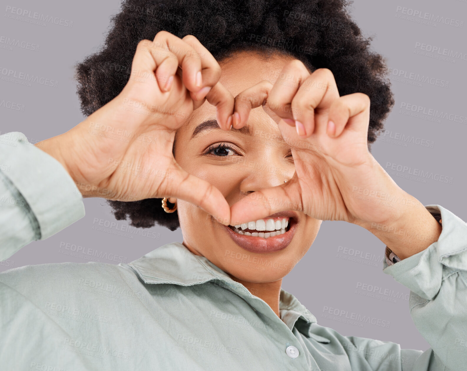 Buy stock photo Heart, eye and hands with portrait of black woman in studio for happiness, support and emoji. Peace, focus and shape with female holding symbol on gray background for hope, kindness and trust