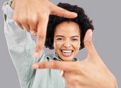 Buy stock photo Happy, portrait and woman with hand frame in a studio posing with a positive face expression. Happiness, smile and headshot of an African female model with a finger border isolated by gray background