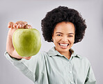 Portrait, apple and black woman smile in studio isolated on a white background. Food, fruit and happiness of person with vitamin c, nutrition or healthy diet, wellness or nutritionist, vegan or detox