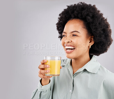 Buy stock photo Thinking, mockup and orange juice with a laughing woman in studio on a gray background for health or vitamin c. Idea, drink and glass with a happy young female drinking a fresh beverage for nutrition