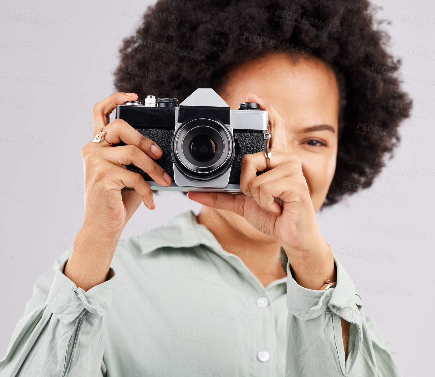 Buy stock photo Portrait, camera photographer and black woman in studio isolated on a white background. Photography, professional and person or female ready to start filming, photoshoot or taking paparazzi picture.