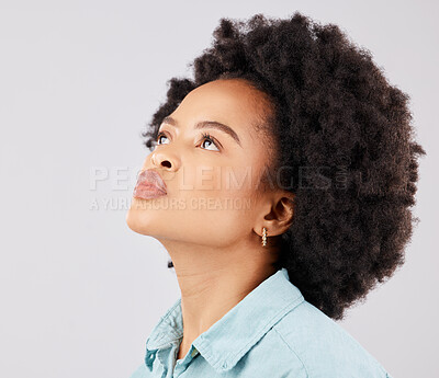 Buy stock photo Black woman, afro and thinking in studio with vision, ideas or looking up by white background. Girl, young model and student with idea, brainstorming or mindset for focus, fashion or calm by backdrop