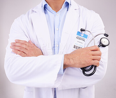 Buy stock photo Arms crossed, stethoscope and man doctor in studio for healthcare, examination or check up on grey background. Hands, cardiovascular or health by medical expert ready for consultation, exam or help