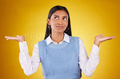 Buy stock photo Choice, thinking and offer with woman in studio for decision, confused and option mockup. Why, show and uncertain with female holding on yellow background for product placement, doubt and results