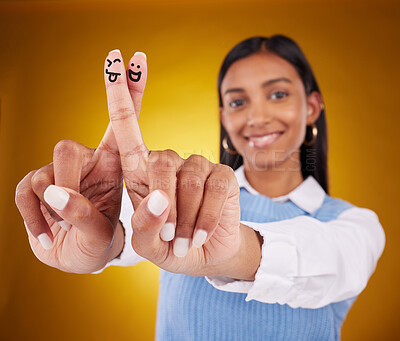 Buy stock photo Fingers, smiley and portrait of indian woman in studio for art, expression and fun on gradient yellow background. Hands, art and drawing by girl smile, excited and content with emoji, gesture or luck