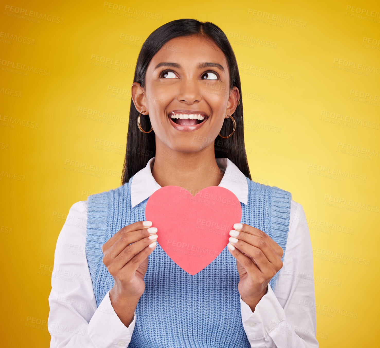 Buy stock photo Smile, paper and heart with woman in studio for love, support and romance. Valentines day, kindness and date with female and holding symbol on yellow background for health, happiness and hope mockup