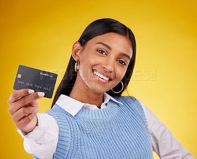 Buy stock photo Credit card, portrait and Indian woman on yellow background for bank, investment and payment in studio. Banking mockup, finance and happy girl with plastic for budget, commerce and promotion purchase