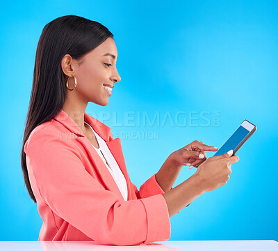Buy stock photo Happy woman, tablet and smile for research, social media or browsing and communication against a blue studio background. Female employee working on touchscreen for business data or search on mockup