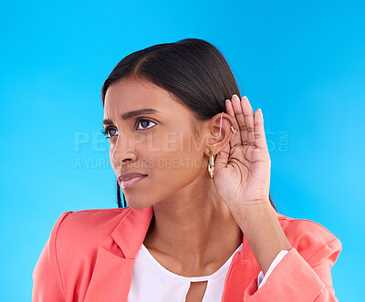 Buy stock photo Listening, secret and gossip with a woman on a blue background in studio cupping her ear for hearing. Privacy, whisper and hand gesture with an attractive young female trying to hear news or a rumor