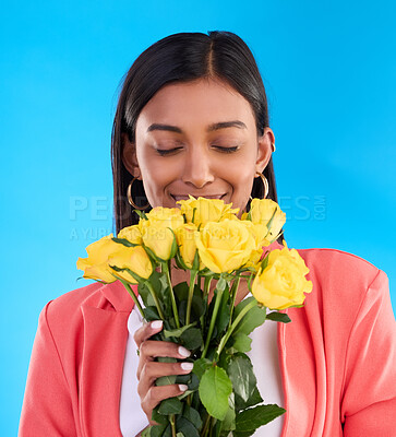 Buy stock photo Scent, flowers and roses with woman in studio for gift, satisfaction and spring. Relax, happy and floral present with female and bouquet isolated on blue background for aroma, natural and products