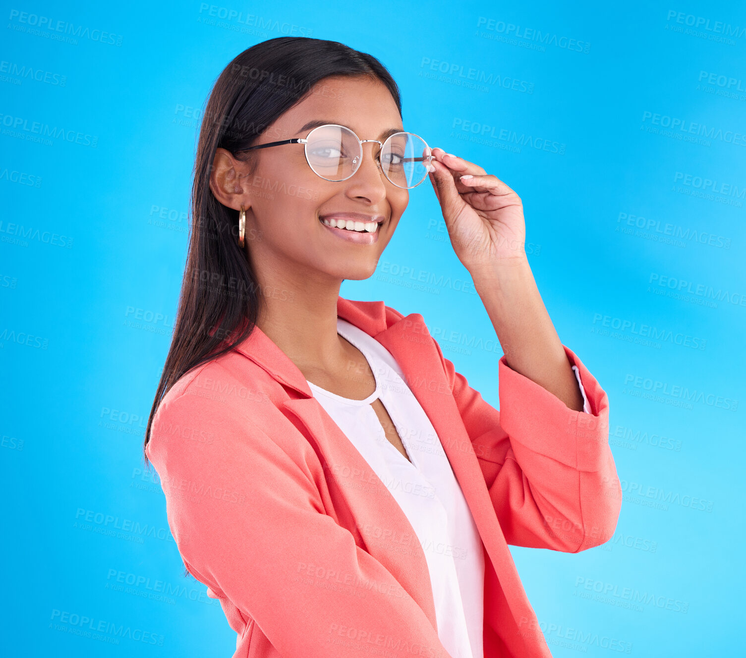 Buy stock photo Woman, glasses and happy portrait in studio with a smile for eye care and vision with frame or lens. Smile of Indian female model person on a blue background with specs for fashion and business