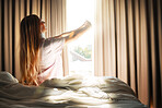 Stretch, calm and woman waking up in the morning to open the curtains in her bedroom at her apartment. Relax, peace and female stretching her arms while in bed getting ready to start her day at home.