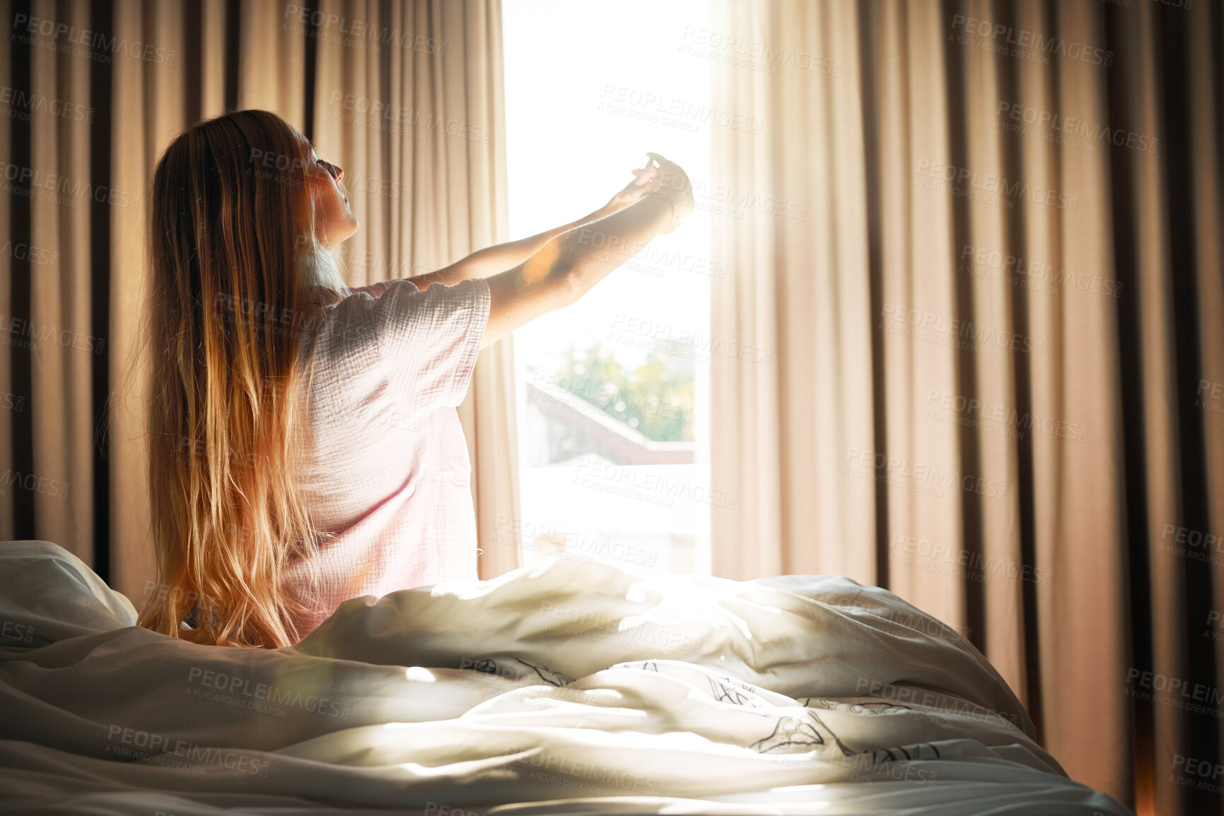 Buy stock photo Stretch, calm and woman waking up in the morning to open the curtains in her bedroom at her apartment. Relax, peace and female stretching her arms while in bed getting ready to start her day at home.